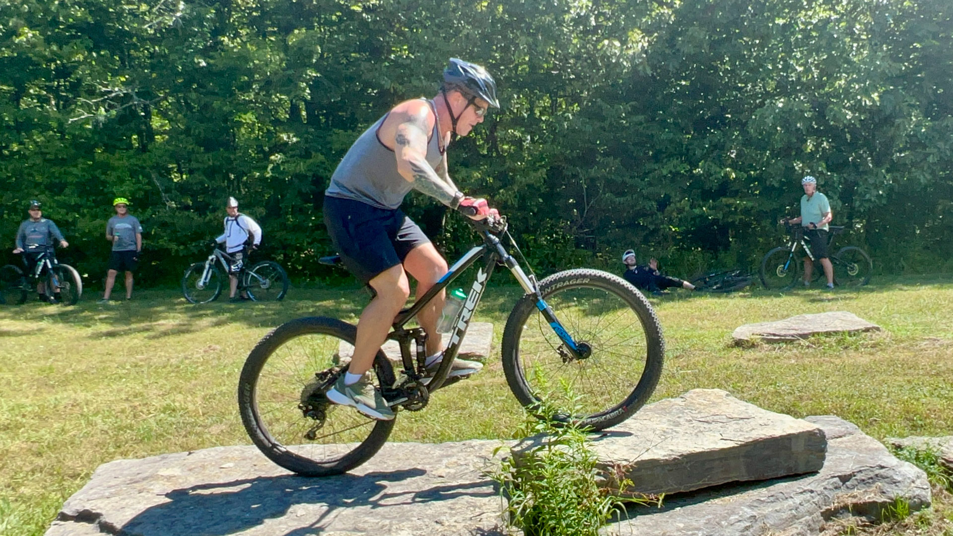 A man biking on a rock