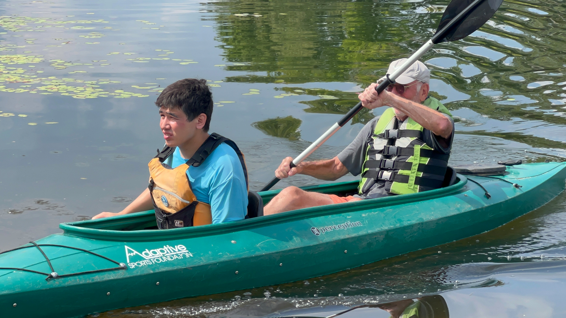 Two men sitting in a kayak
